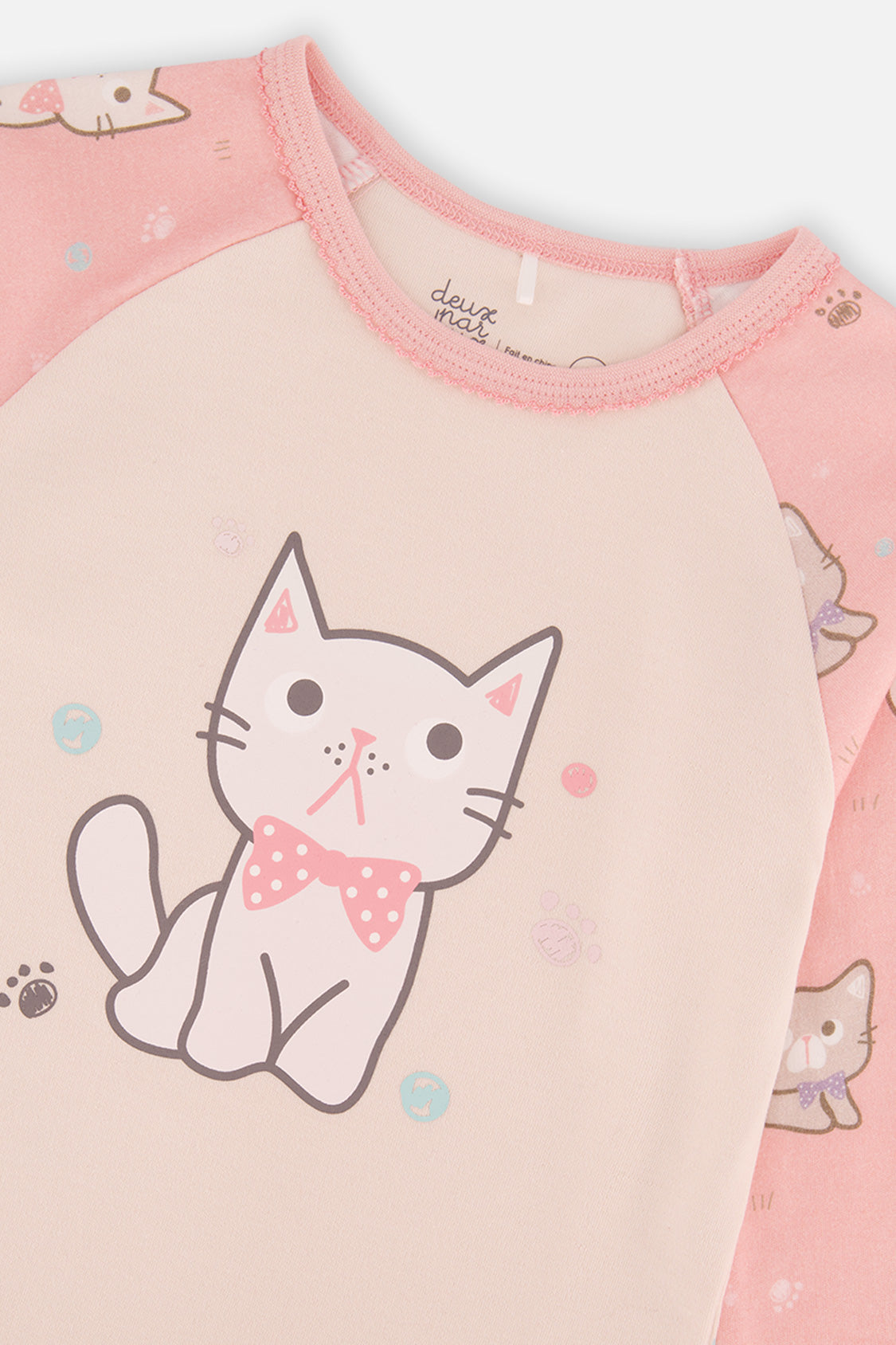 Close-up detail of the pink cat print organic cotton pajama set by Deux par Deux