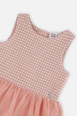 Close-up of the pink and white houndstooth jacquard bodice and mesh skirt seam