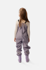 Child wearing the Deux par Deux mauve rain overalls, second lookbook shot