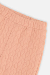 Close-up of the Wide Leg Jacquard Pants Pink quilted fabric and elastic waist