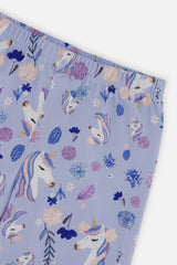 Close-up of the elastic waistband and unicorn and flower print on the purple leggings