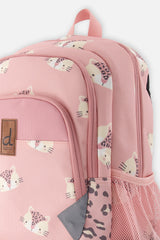 Closeup of Deux par Deux leopard backpack with front pocket, zippers, and side water bottle pocket.
