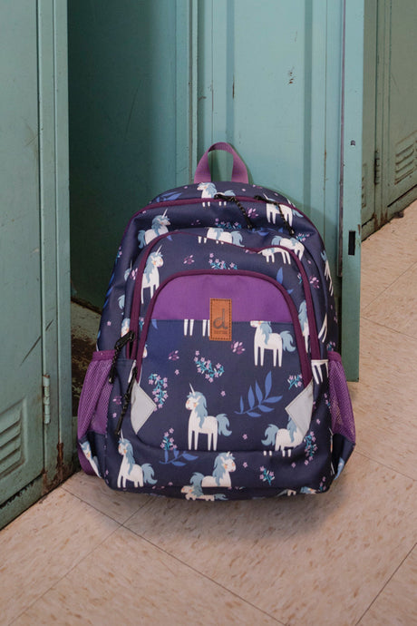 Lifestyle image of Blue unicorn preschool backpack displayed in a school hallway setting.