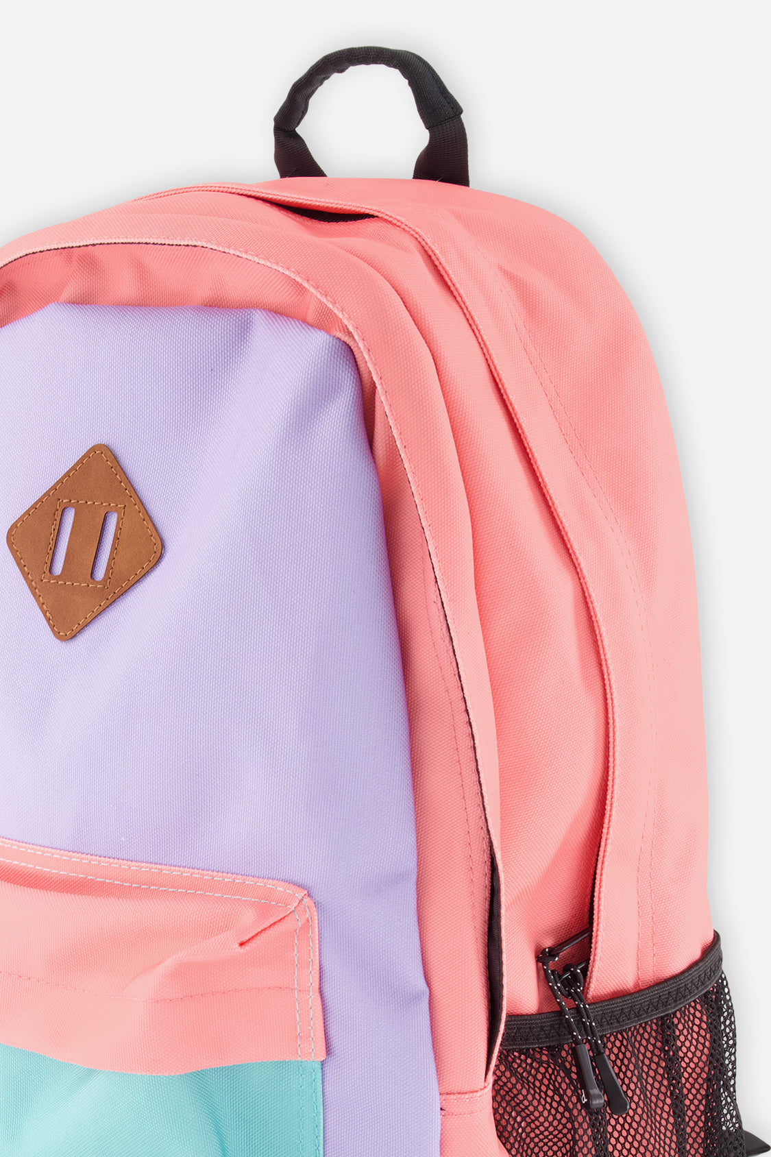 Closeup of color-block backpack front pocket, zipper details, and recycled polyester finish.