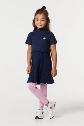 Girl wearing Noppies Gondiya navy ribbed dress with pink leggings, front view