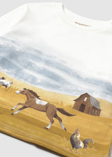 Closeup of farm scene print on 100% cotton jersey.