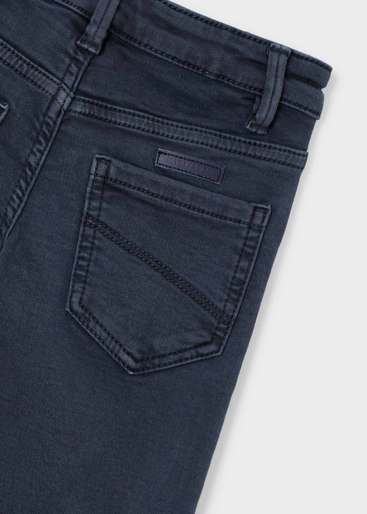 Closeup of waistband with button/zip and inner-button adjusters.