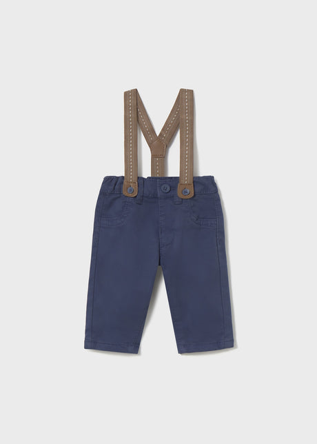 Front flat lay of newborn navy baby pants with Tan detachable suspenders.