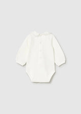 Ivory long-sleeve newborn bodysuit showing back-neck and crotch snaps