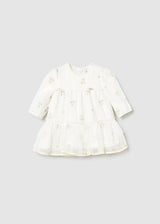 Front view of Ivory/Gold dot tulle baby dress with long sleeves and gathered skirt.