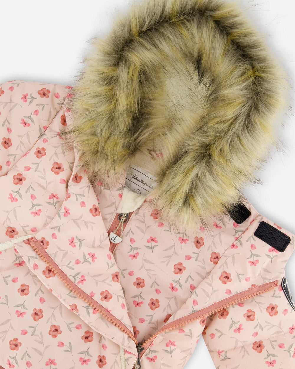 Close-up of water-resistant zipper and chin guard, baby girl snowsuit
