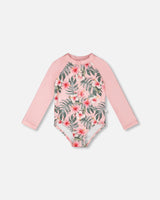 Front flat lay of Deux par Deux girl long sleeve one-piece rashguard in pink hibiscus print