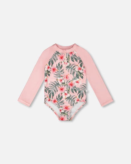 Front flat lay of Deux par Deux girl long sleeve one-piece rashguard in pink hibiscus print