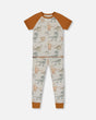 Organic Cotton Two-Piece Short Sleeve Top And Pant Pajama Set Dinosaur On Mottled And Tan Background | Deux par Deux | Jenni Kidz