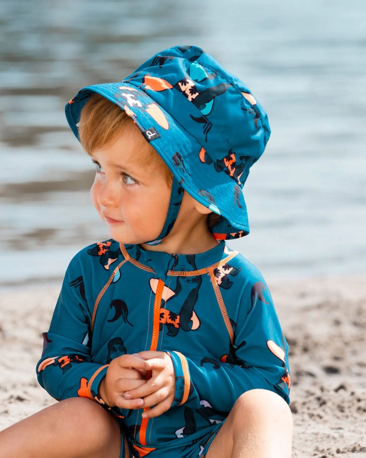 Printed Beach Hat Orange Sloths On Navy Blue | Deux par Deux | Jenni Kidz