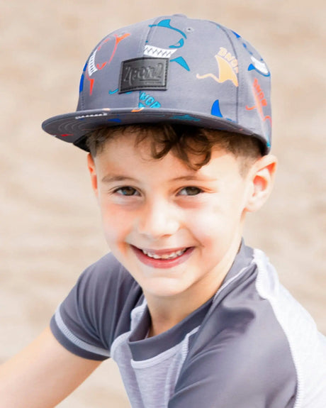 Printed Cap Orange, Red, And Blue Sharks On Gray | Deux par Deux | Jenni Kidz