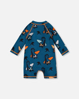 Printed Long Sleeve One-Piece Rashguard Orange Sloths On Navy Blue | Deux par Deux | Jenni Kidz