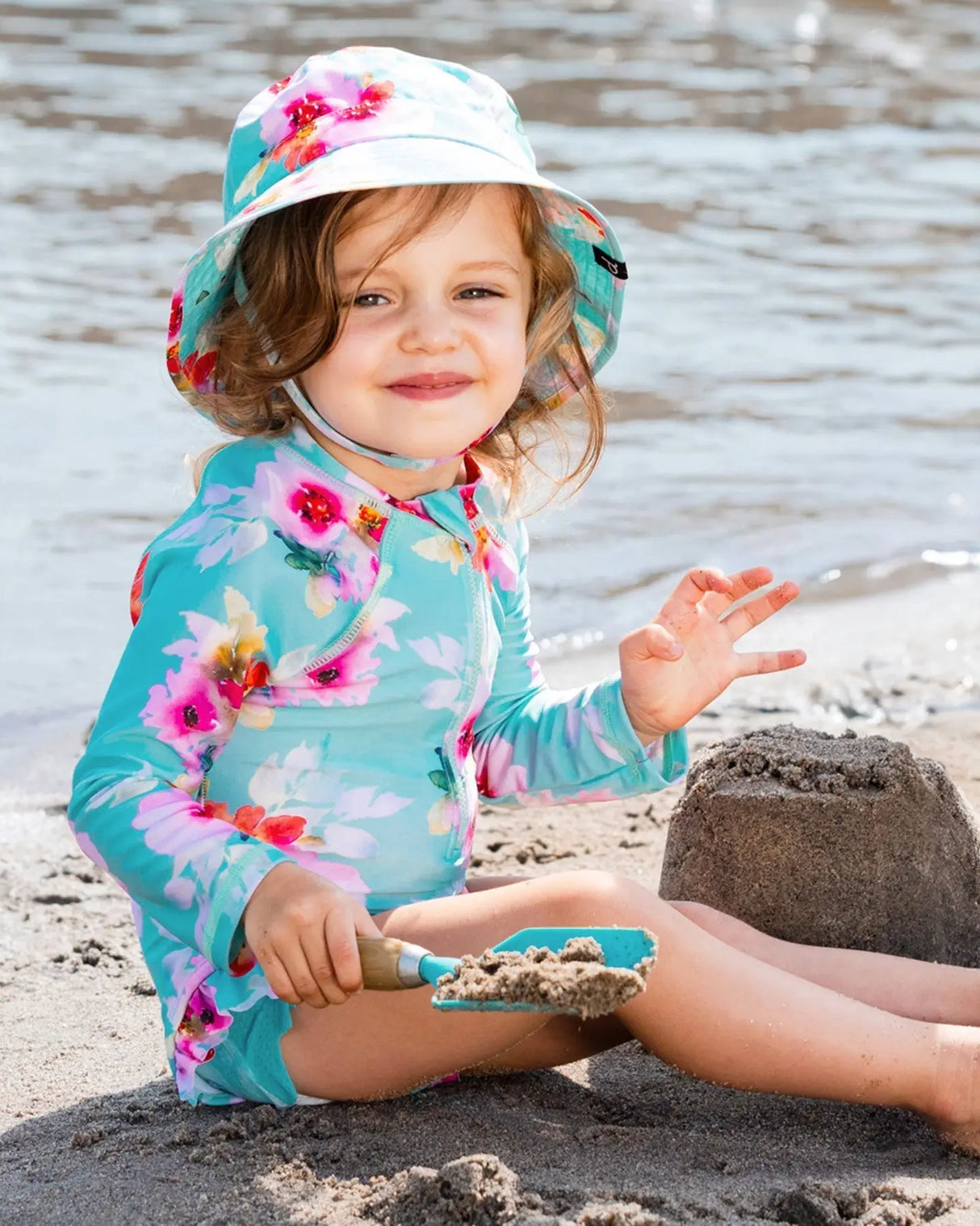 Printed One-Piece Rashguard With Frills Turquoise And Pink Flowers | Deux par Deux | Jenni Kidz