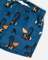 Printed Swim Trunks Orange Sloths On Navy Blue | Deux par Deux | Jenni Kidz