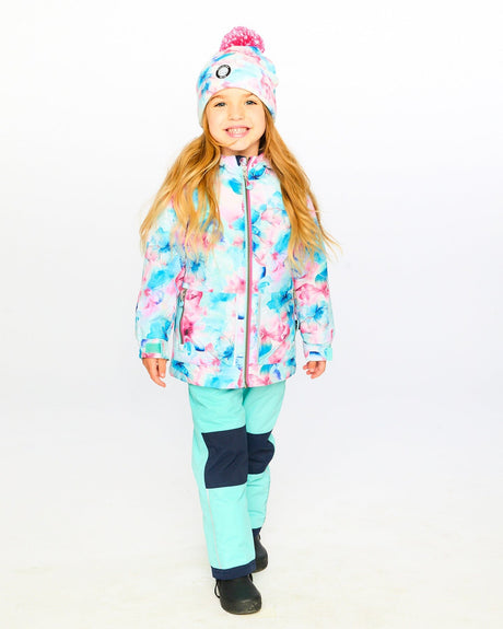 Ready for snow: child wearing Deux par Deux turquoise chill snowsuit outdoors