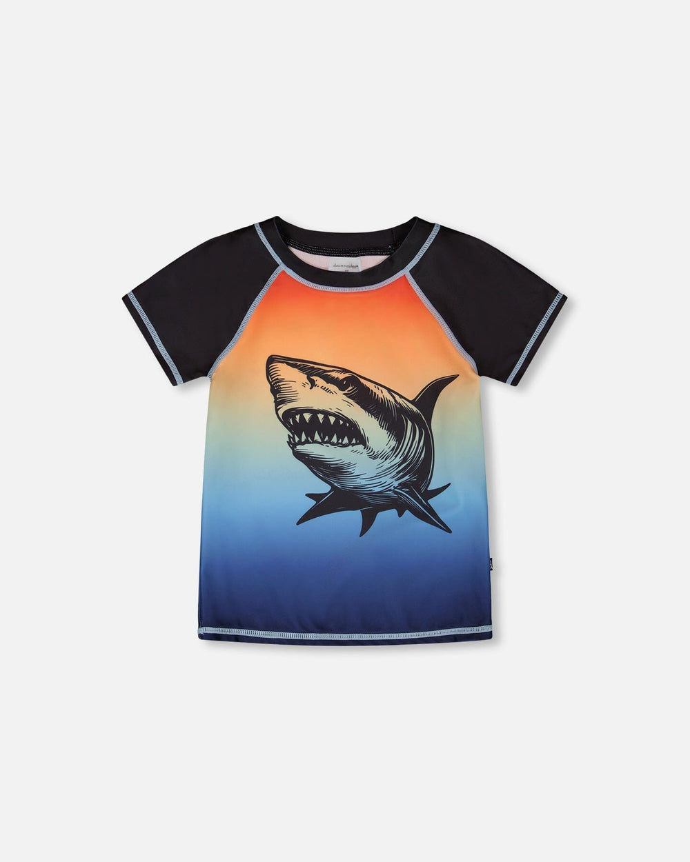 Front flat lay of Deux par Deux boy short sleeve kids rashguard with blue and orange gradient and shark graphic