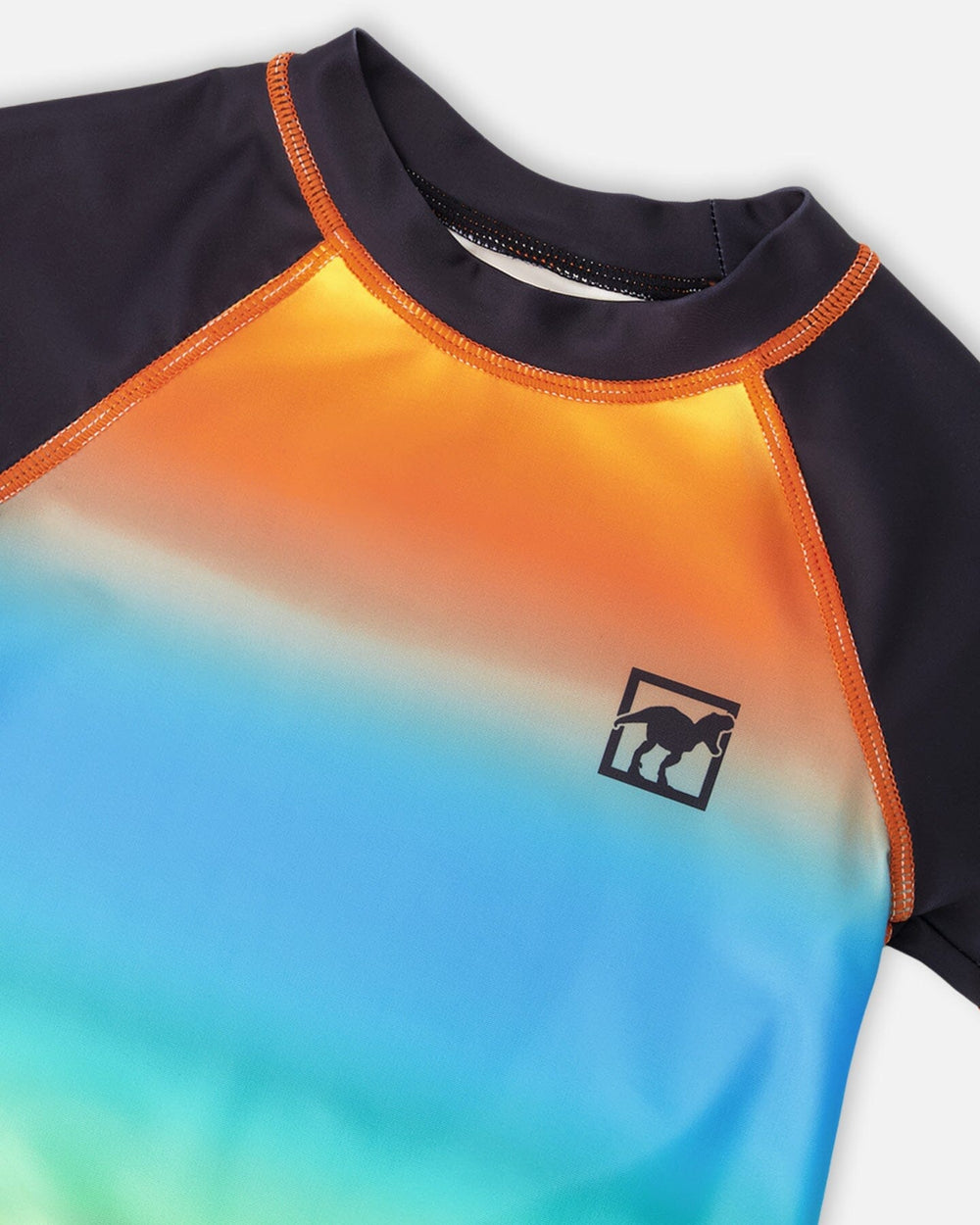 Close-up of neckline and logo on orange blue green gradient rashguard swim shirt