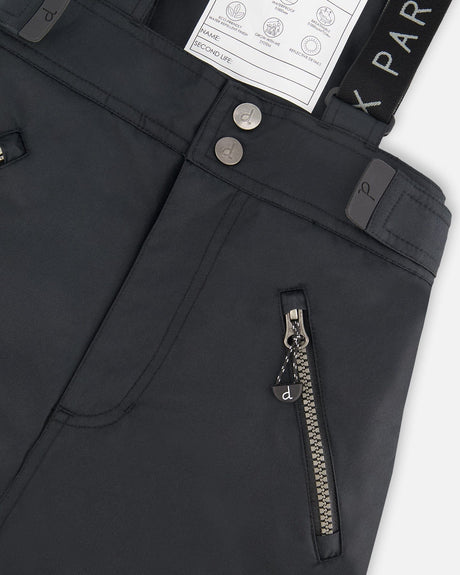 Closeup of pocket zip and suspenders, Cordura panel detail.