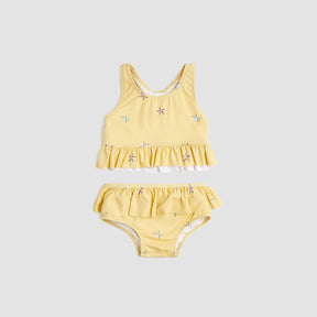 Miles The Label baby girls and girls Sunrise starfish two-piece swimsuit with UPF 50+ and frilly details.