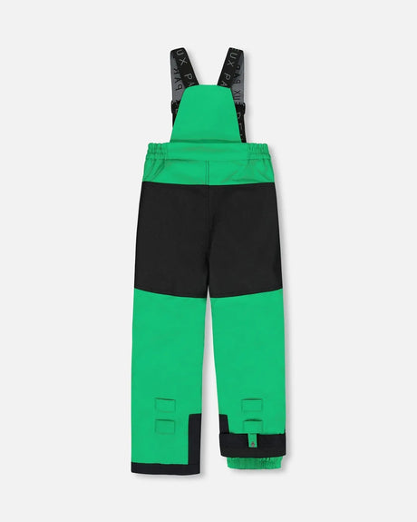 Close-up Cordura® knee on Deux Par Deux green bib pants, reinforced for durability