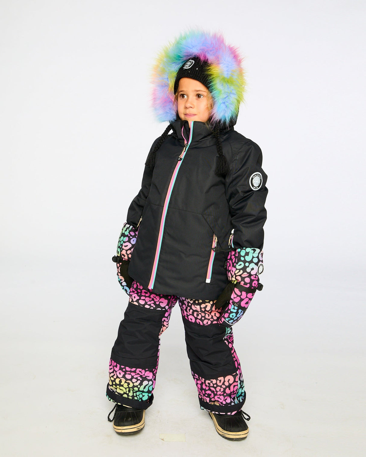 Action shot: rainbow leopard jacket and snow pants, breathable and cozy on the hill.