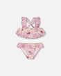 Front flat lay of Deux par Deux girl purple flower two-piece swimsuit with ruffled top and bottoms
