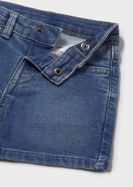 Closeup of Mayoral baby boy denim shorts showing waistband, pocket detail, and Light Blue fabric.