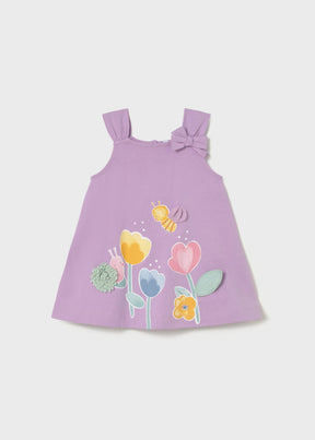 Mayoral baby girl Lilac graphic dress with floral front print, wide straps, and playful bee detail.
