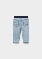 Back view of Mayoral baby boy jogger jeans showing Light Blue denim wash and cuffed leg openings.