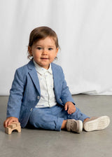 Sitting baby in Mayoral baby boy blazer styled for family photos and dressy events.