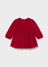 Back of the red pleated Mayoral dress with neck zip and gathered cuffs