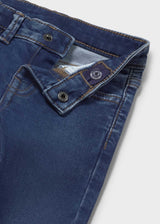 Closeup of Mayoral baby boy jeans showing waistband, button detail, and denim texture.
