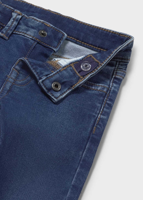 Closeup of Mayoral baby boy jeans showing waistband, button detail, and denim texture.