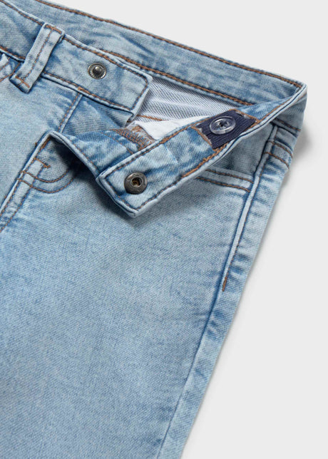 Closeup of Mayoral baby boy jeans showing waistband, button detail, and light denim texture.