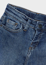 Closeup of Mayoral boys jeans showing waistband, pocket detail, and Blue cotton denim fabric.