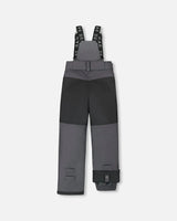Rear view of dark gray kids snow pants with suspenders