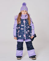 Child wearing Deux Par Deux unicorn lavender snowsuit front view, breathable and warm