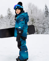 Lifestyle photo – toddler snow play in Deux par Deux teal gradient snowsuit
