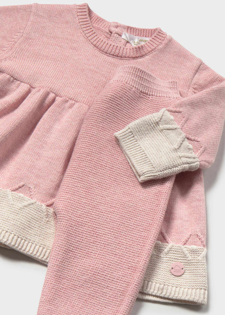 Close-up of Mayoral newborn girl outfit set showing Pink cotton dress, matching leggings, and Cream cuffs.