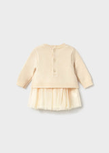 Back of the cream Mayoral knit dress with button closure and tulle skirt