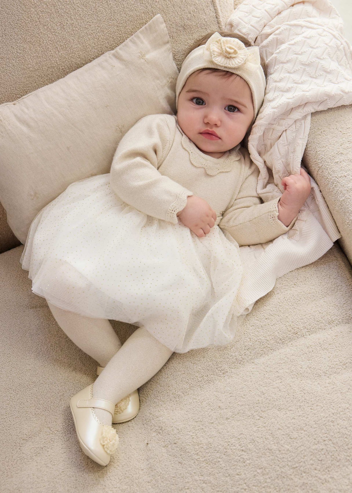 Baby girl wearing Mayoral Ivory tulle dress for photos, birthdays, and special occasions.