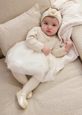 Baby girl wearing Mayoral Ivory tulle dress for photos, birthdays, and special occasions.