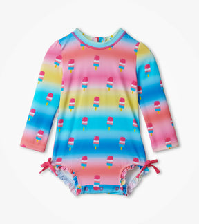Hatley baby girl Sweet Treats rashguard swimsuit in Aqua/Pink with long sleeves and ruffle legs